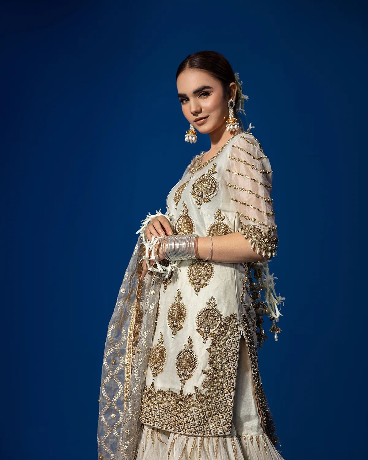 Pakistani Wedding Dress in White Kameez Gharara Style Nameera by Farooq