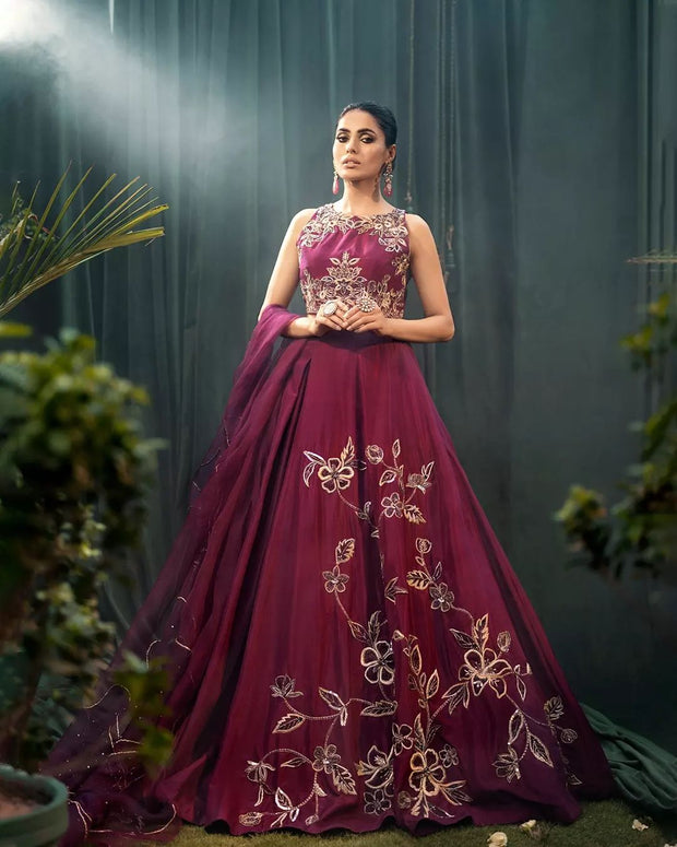 Exquisite raw silk gown adorned with our intricate and rich hand embroidery  paint a picture of ethereal beauty.