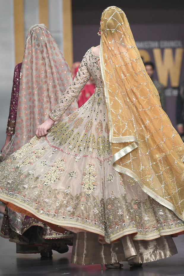 Pakistani Bridal Anarkali Froke in Gold Color for Wedding Backside