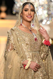Pakistani Peplum Lehnga in Gold Color for Wedding Close Up
