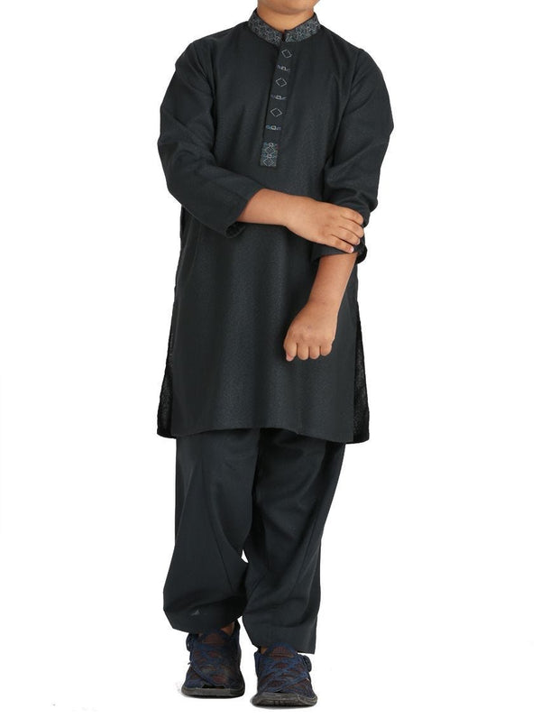 Pakistani machine embroidered dress in dark green color