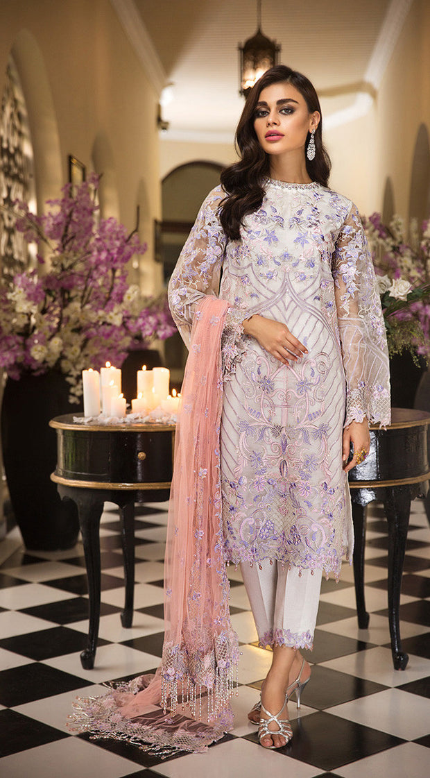 Pakistani thread embroidered dress in an elegant light color