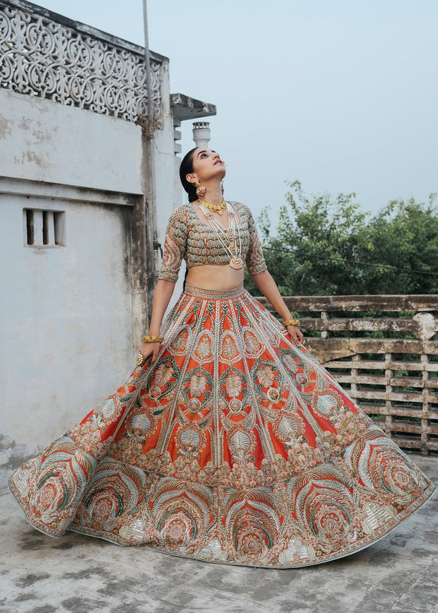 Latest silk embroidered lehnga in orange color for wedding wear # B3409