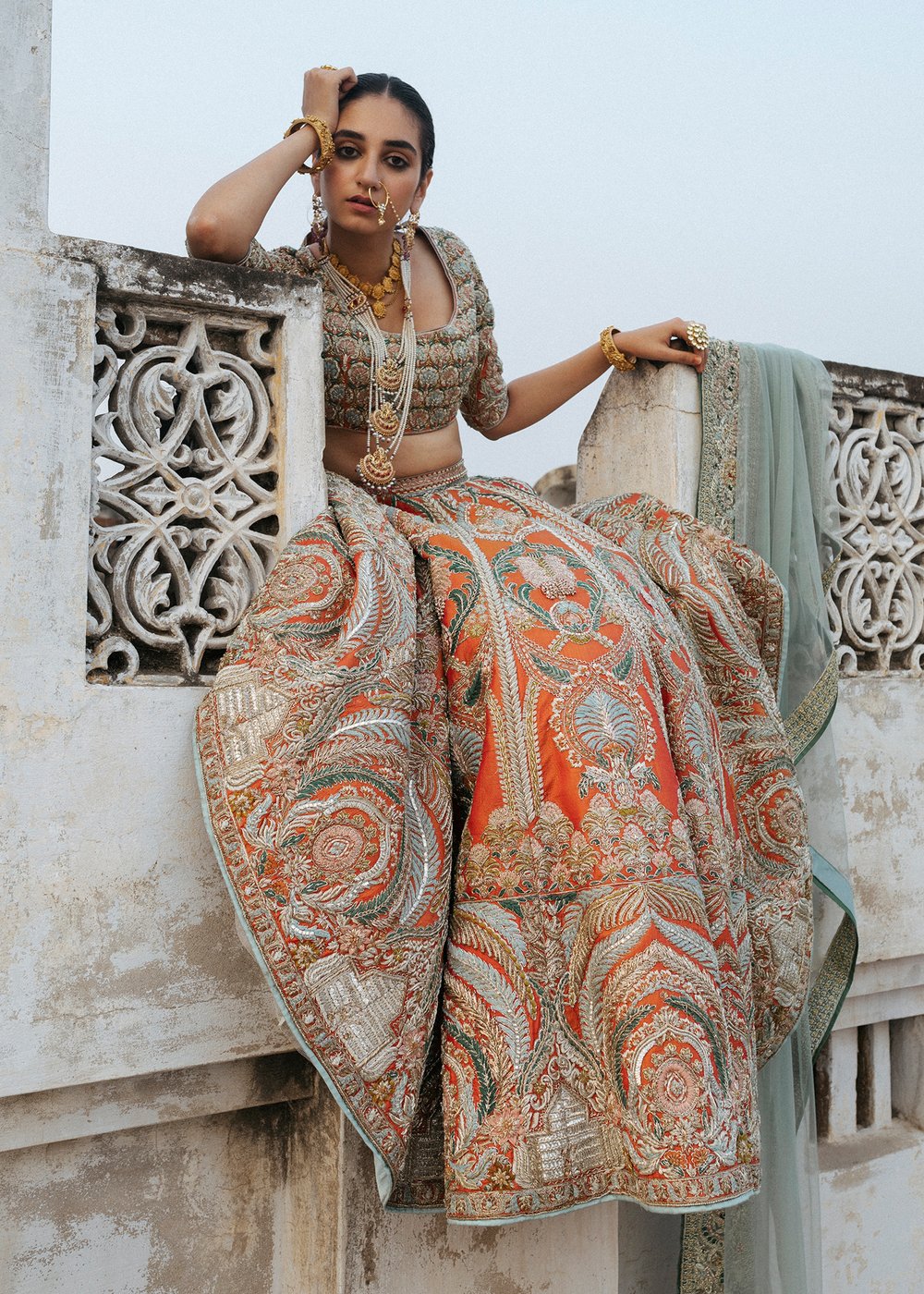 Latest silk embroidered lehnga in orange color for wedding wear # B3409