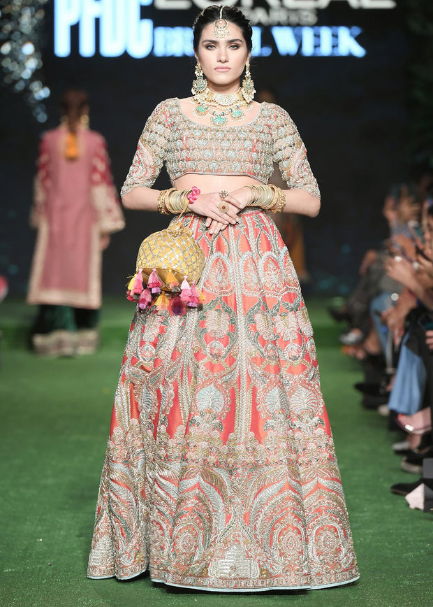 Latest silk embroidered lehnga in orange color for wedding wear