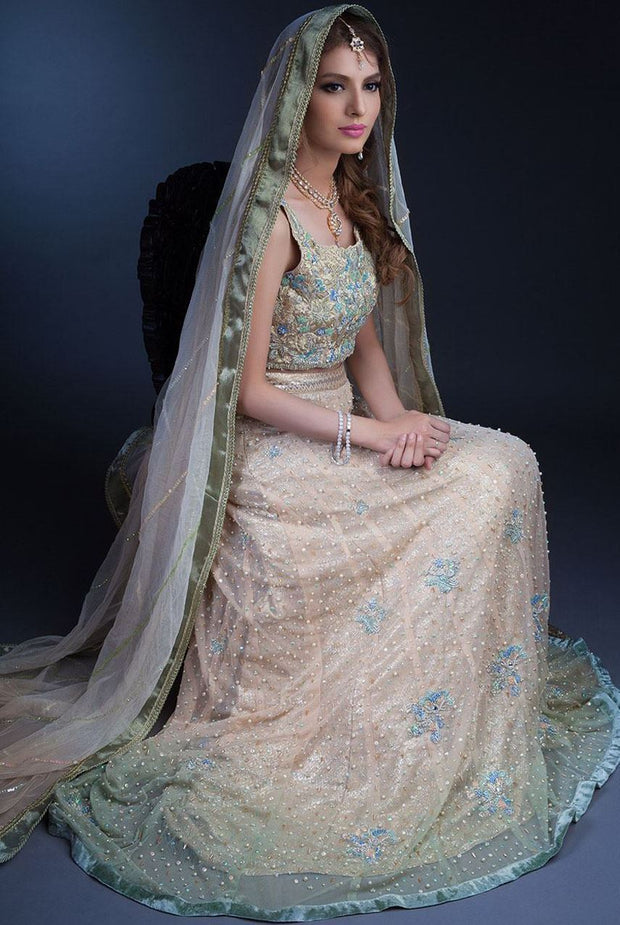 Elegant white peach lehnga with mukaish and gotta work