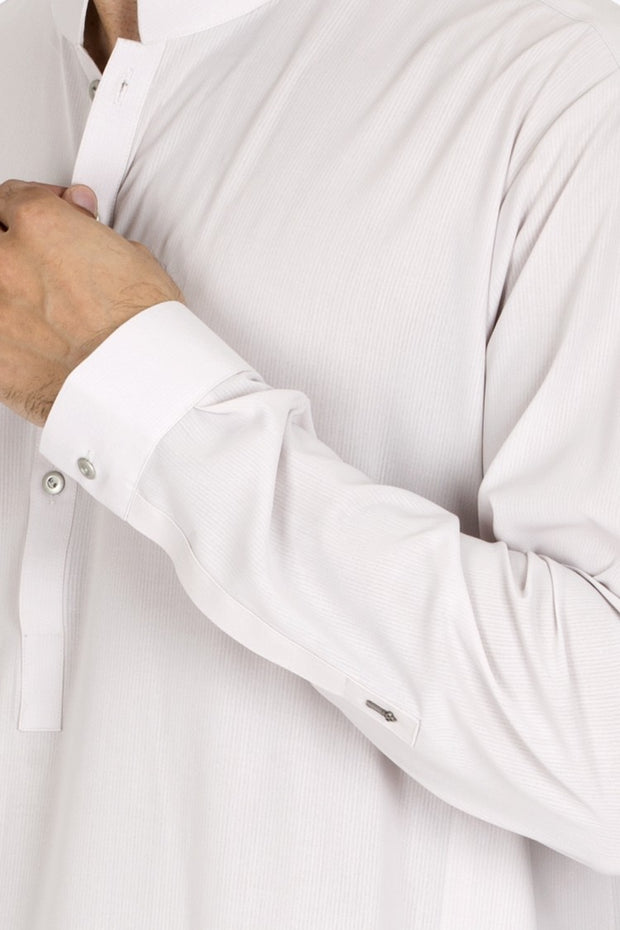 closeup picture of cream color kameez