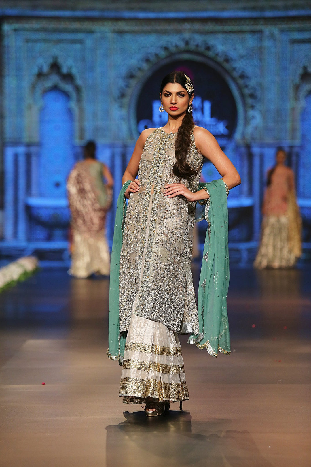 Designer embroidered dress in gold, white and green color 