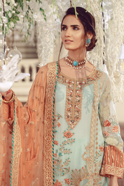 Pakistani embroidered formal eid outfit in green and peach color