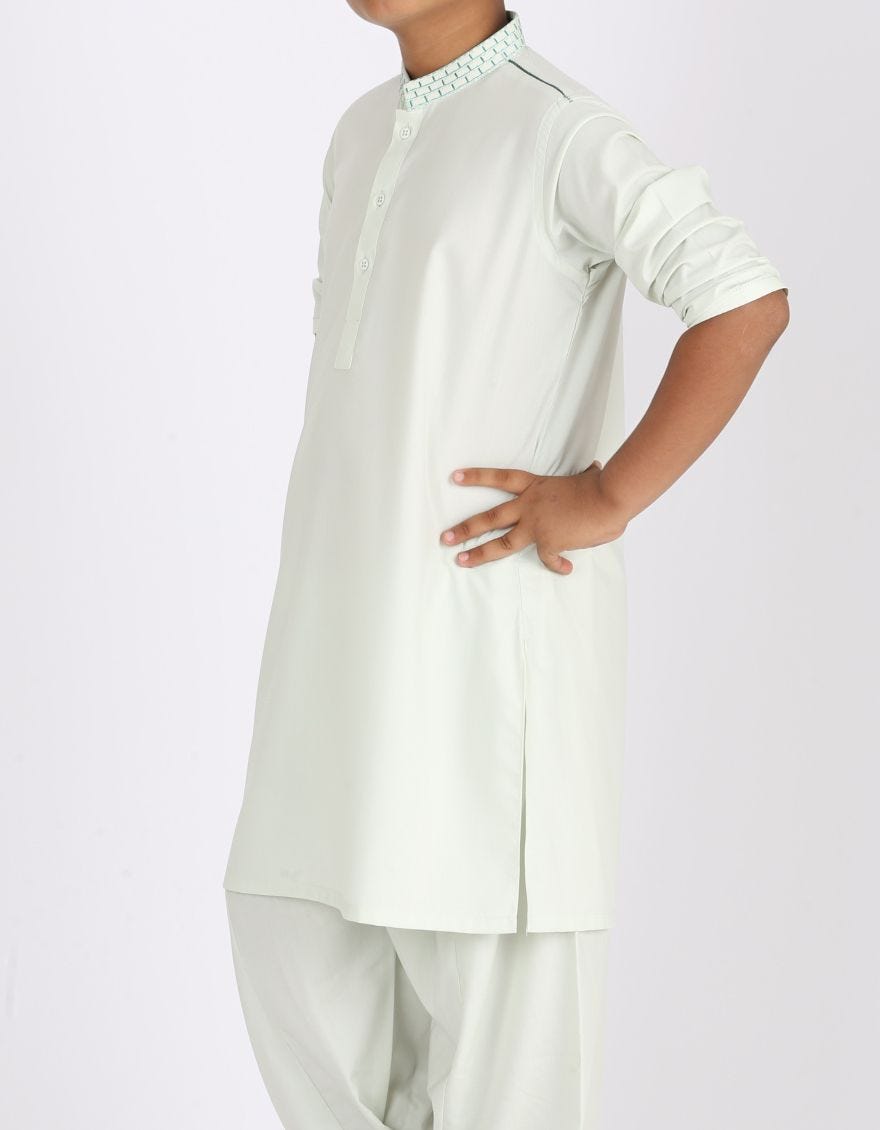 Pakistani machine embroidered dress in light green color # K2313