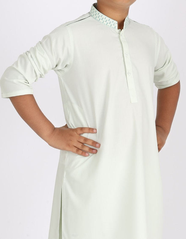 Pakistani machine embroidered dress in light green color # K2313