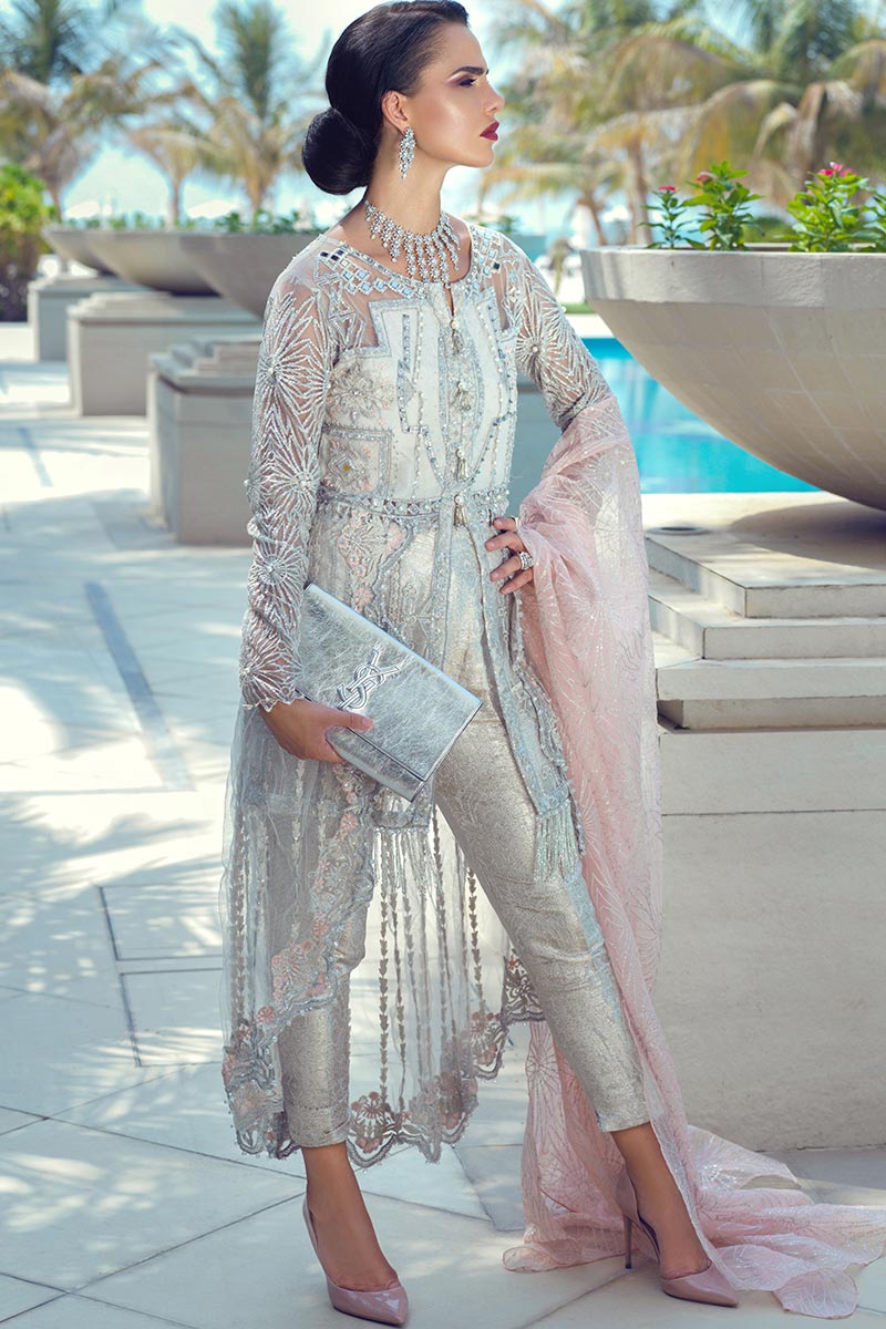 Latest designer net embroidered party dress in elegant white color 