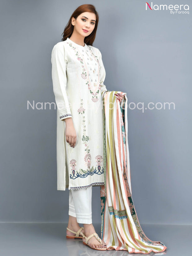 white  embrioded khaddar dress 